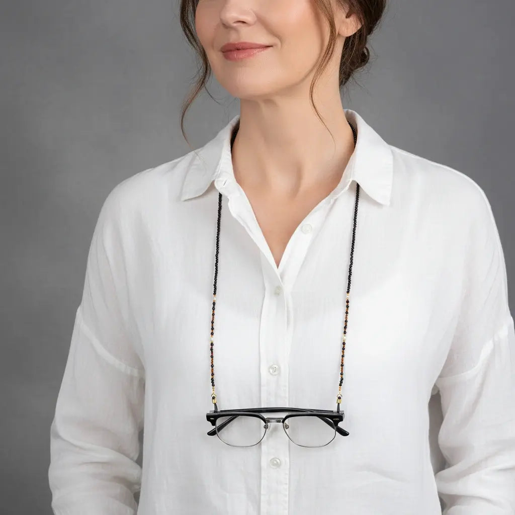 Guardian’s Grace black agate eyewear chain worn around the neck like a necklace, showcasing versatile gemstone jewelry design.