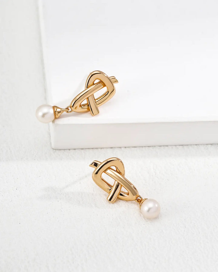 Quiet Knot pearl stud earrings side detail view