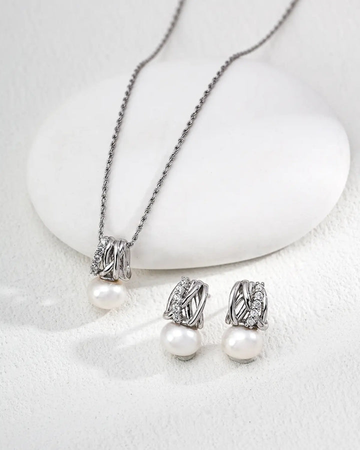 Radiant Knot pearl stud earrings styled with silver pearl necklace