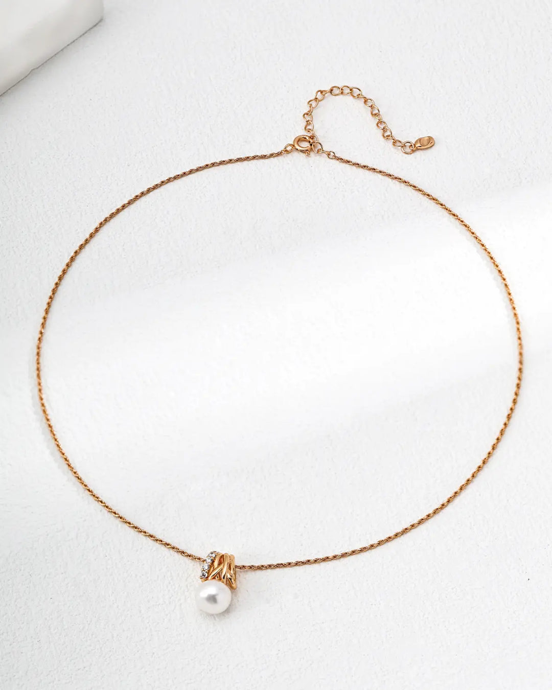 Radiant Knot freshwater pearl necklace with gold knot pendant
