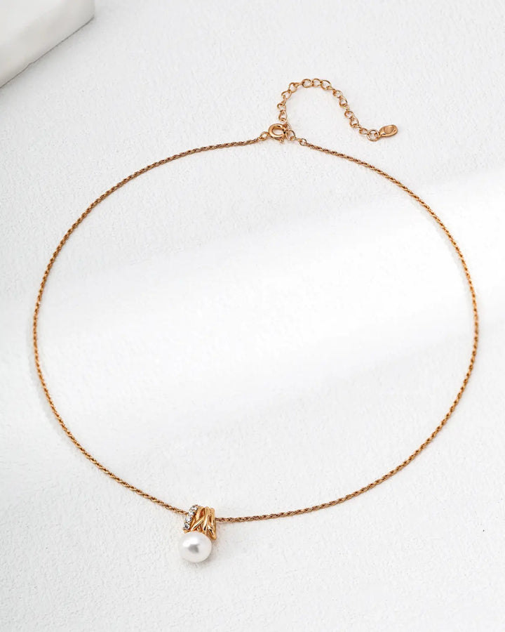 Radiant Knot freshwater pearl necklace with gold knot pendant