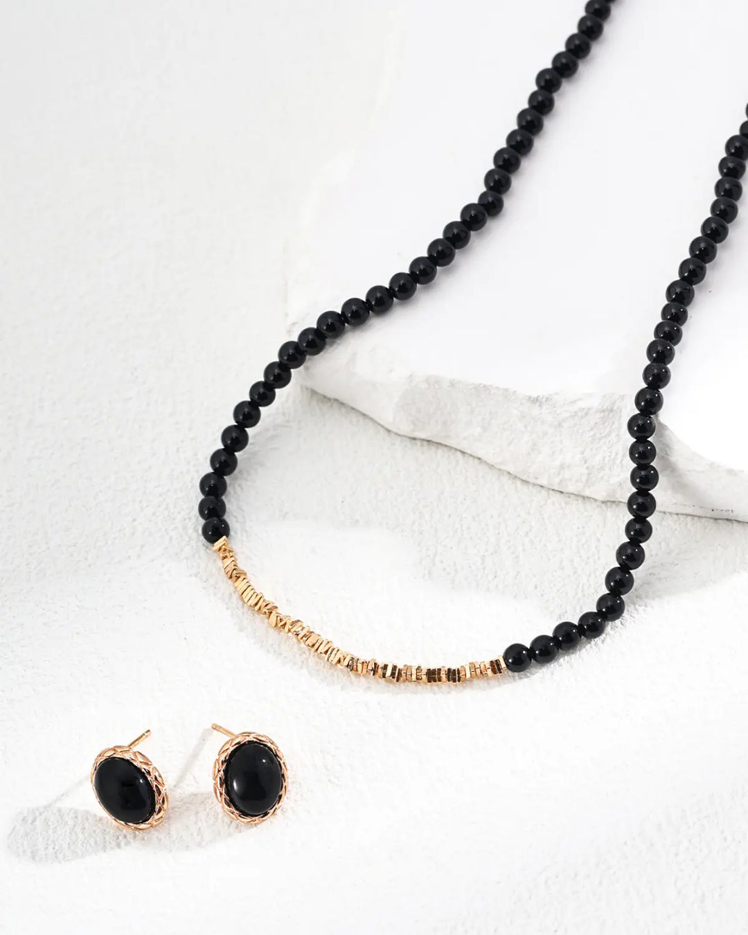 Guardian’s Gaze black agate stud earrings styled with matching necklace
