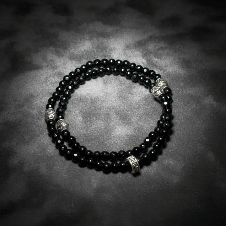 Black agate double wrap bracelet handmade with faceted gemstone beads, designed by Oculux Jewelry.