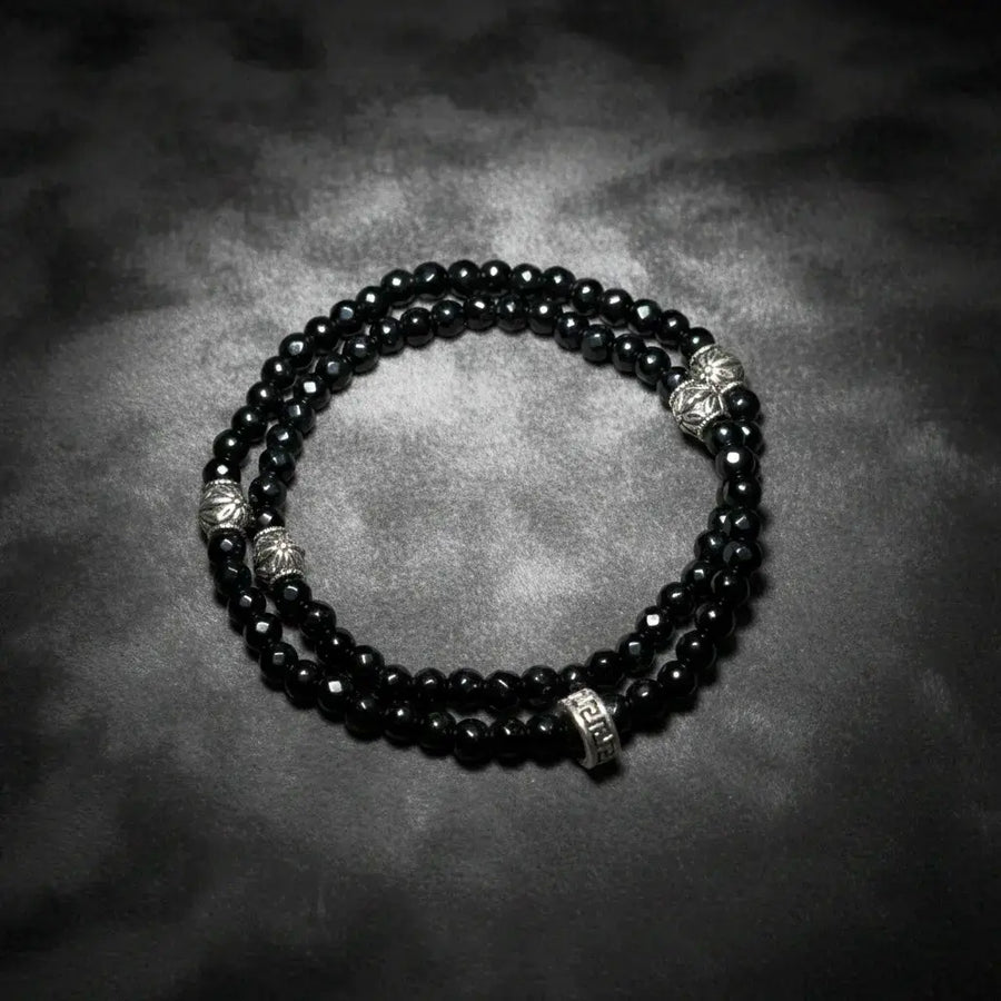 Black agate double wrap bracelet handmade with faceted gemstone beads, designed by Oculux Jewelry.