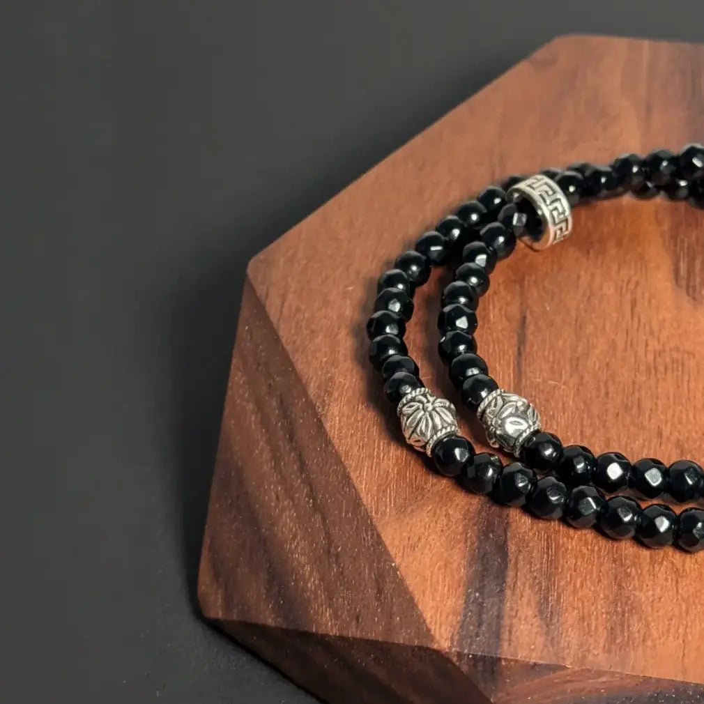 Black agate double wrap bracelet handmade with faceted gemstone beads, designed by Oculux Jewelry.